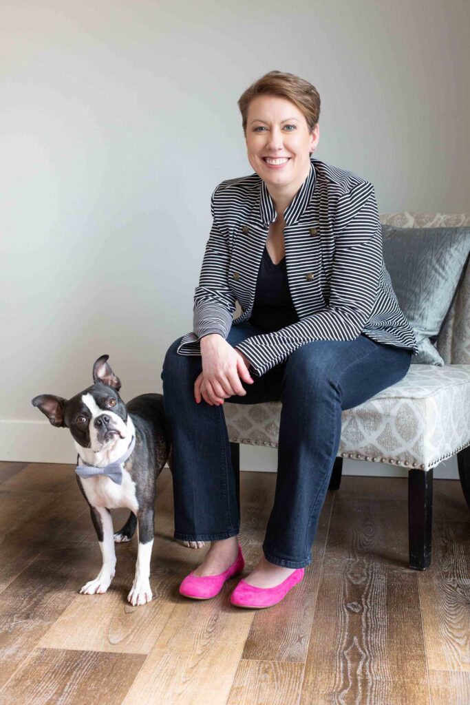 Woman poses with her dog for her branding session