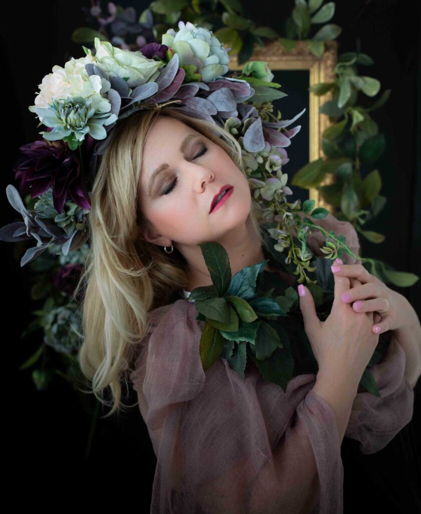 woman poses in flower crown