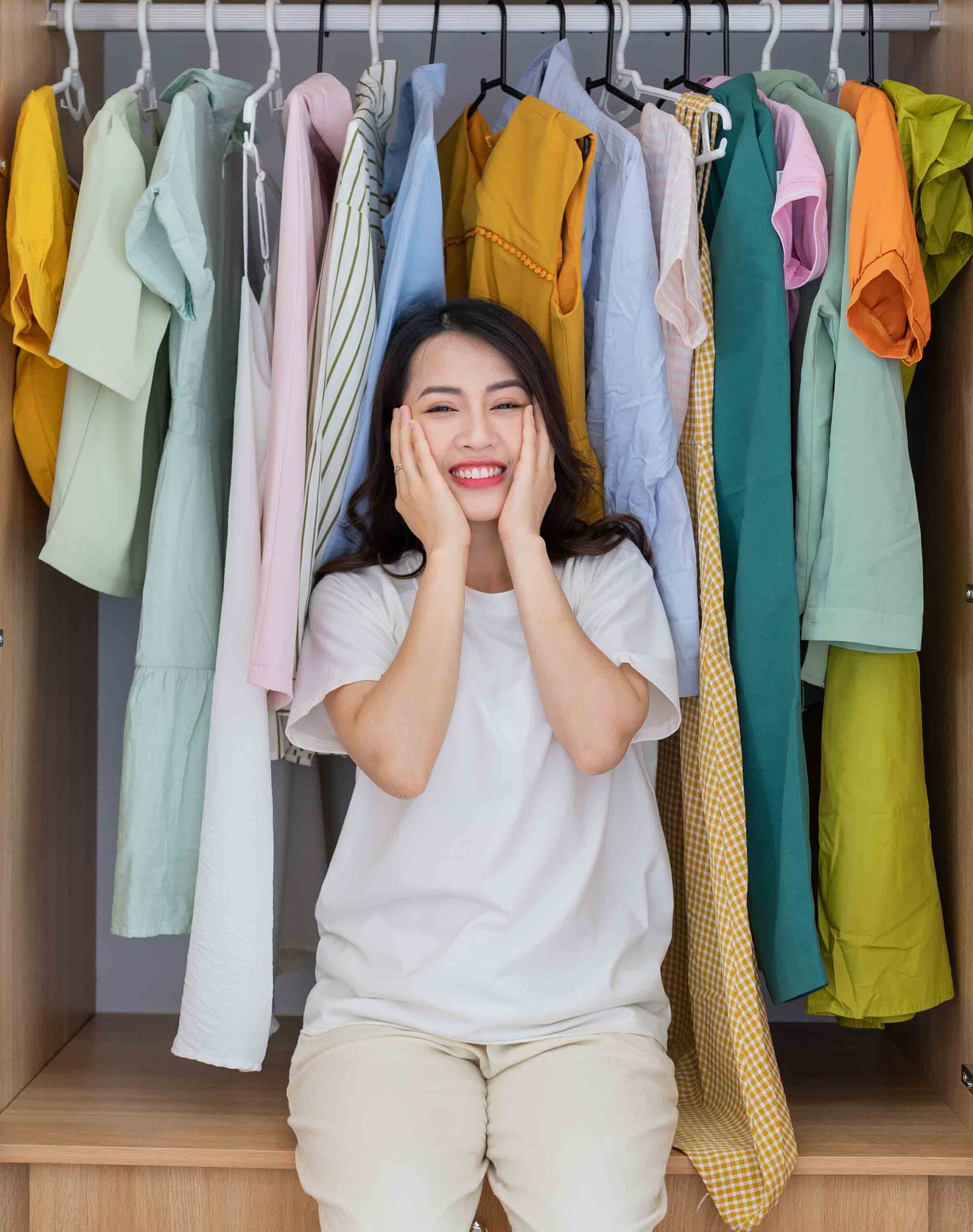 Woman looking confused in front of her closet