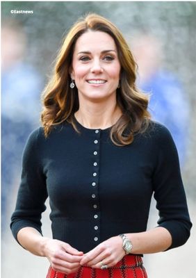 Princess Kate stands with arms bent and fingers touching - copyright Eastnews